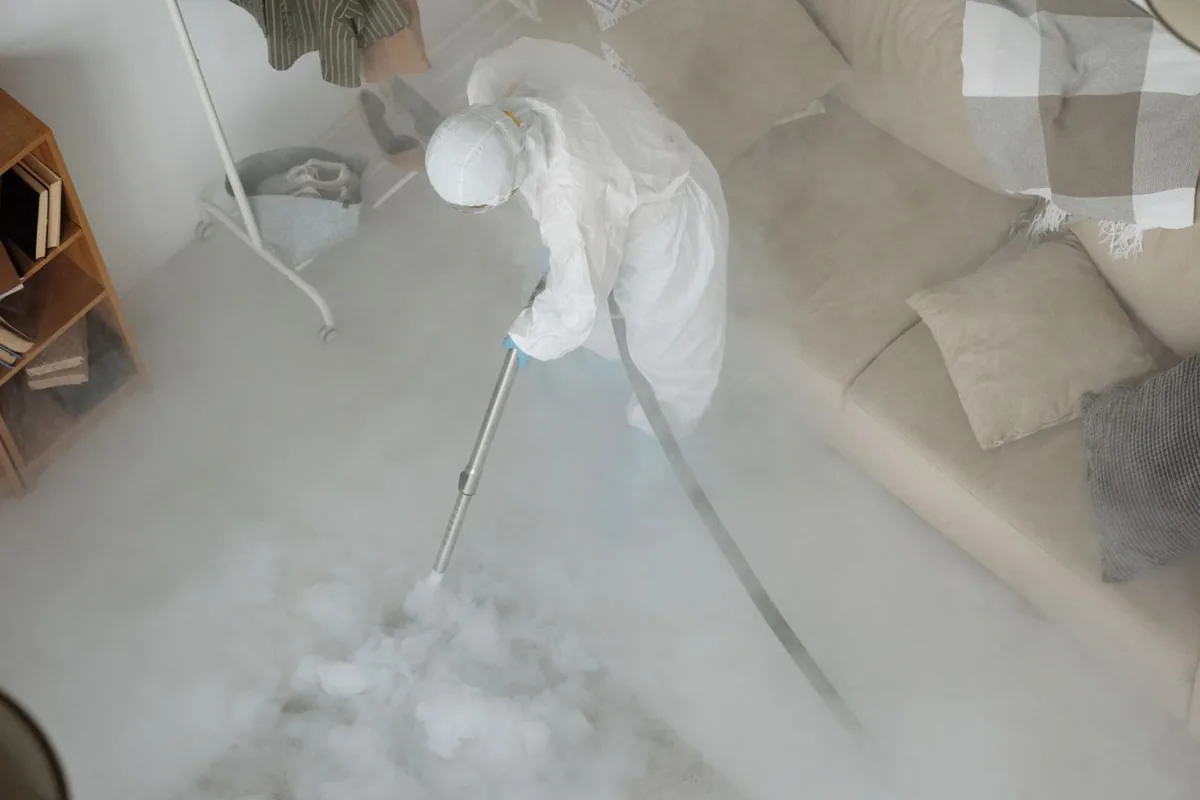 Biohazard cleanup technician in protective equipment, Bethpage, NY
